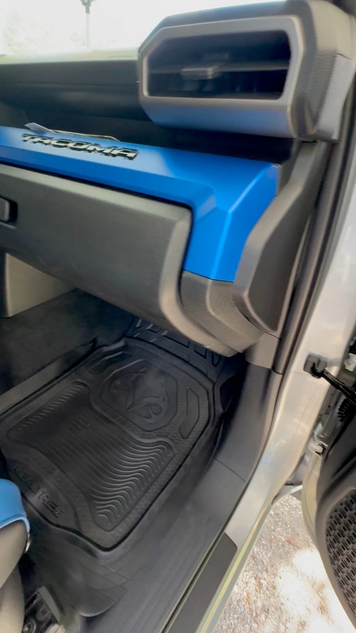 Clean floor mats and dash inside a Toyota TRD after detailing